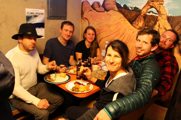 Guests having dinner at the Lazy Lizard Hostel